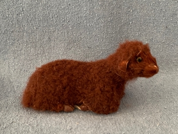 Bild von Schaf klein liegend braun